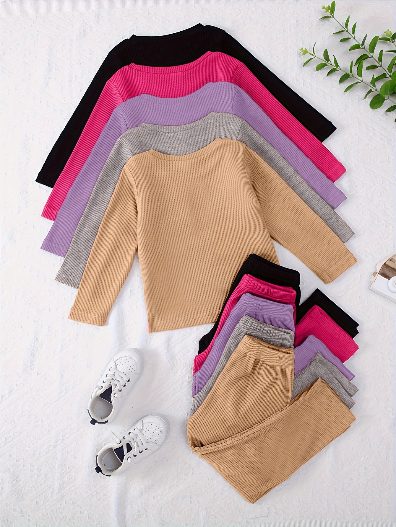 10-piece girls' solid color waffle-knit loungewear sets, featuring long-sleeve tops and matching pants made from soft and comfortable fabric.