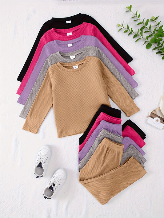 10-piece girls' solid color waffle-knit loungewear sets, featuring long-sleeve tops and matching pants made from soft and comfortable fabric.